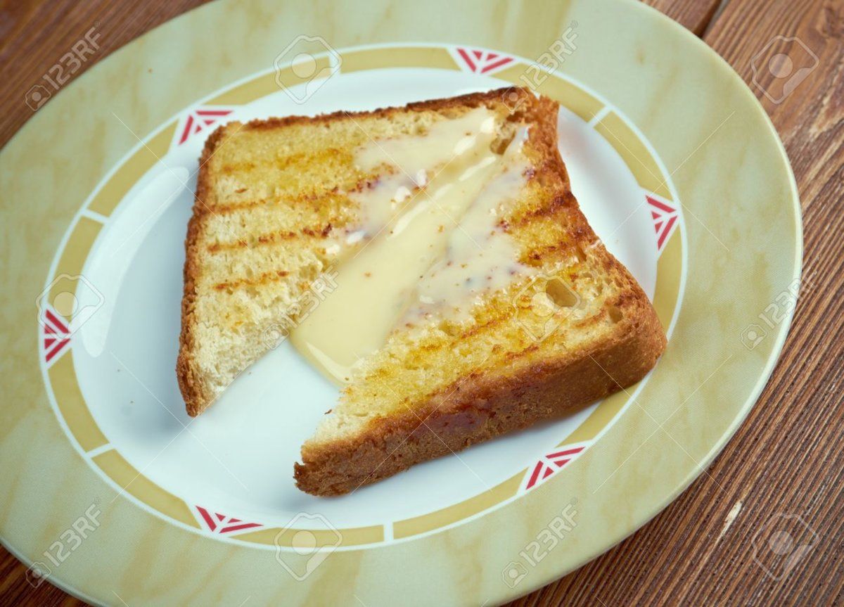 34608702-milk-toast-breakfast-food-of-toasted-bread-in-warm-milk-with-sugar-and-butter-in-new-...jpg