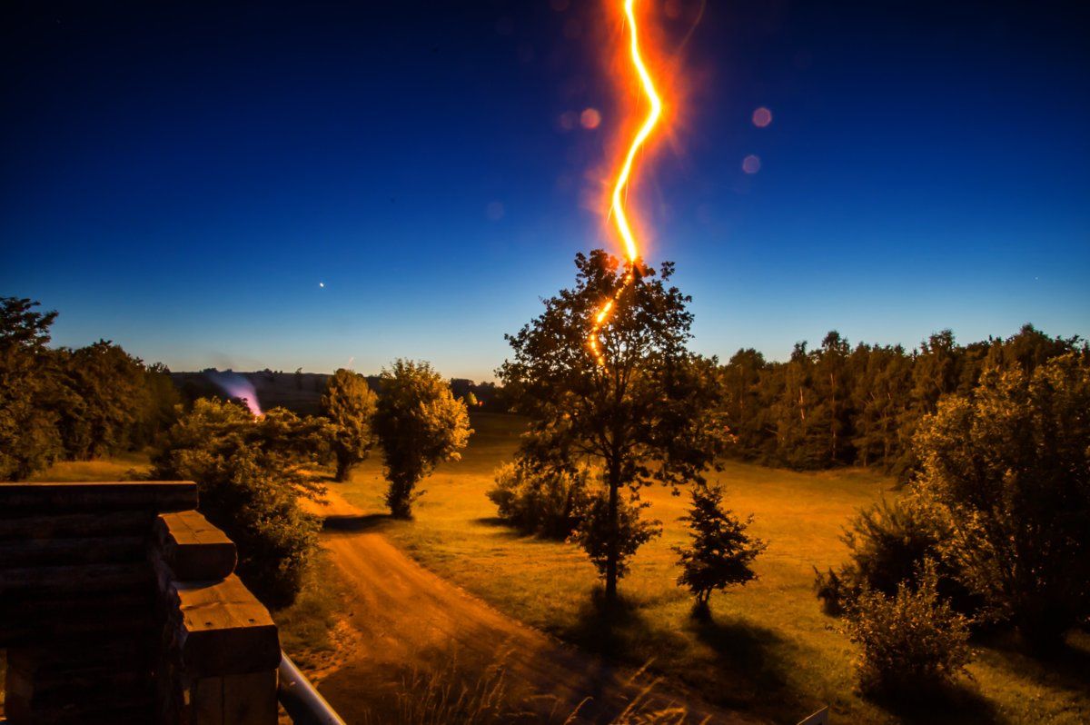 lightning-strikes-tree-in-front-of-house-during-nighttime-1681437.jpg