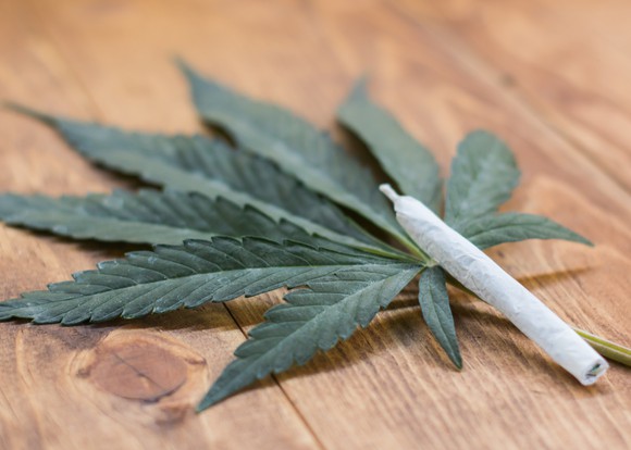 marijuana-joint-over-cannabis-leaf-pot-weed-legalize-getty_large.jpg