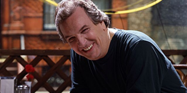 Portrait of American actor Danny Aiello, in costume (as 'Sal') smiles as he poses on the set of the film 'Do the Right Thing' (directed by Spike Lee), New York, 1989.