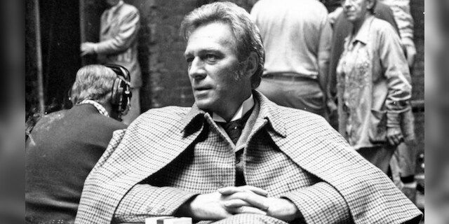 Christopher Plummer wearing his 'Sherlock Holmes' costume as he relaxes during a break in filming 'Murder by Decree' in Clint Street, London, July 29th 1978.