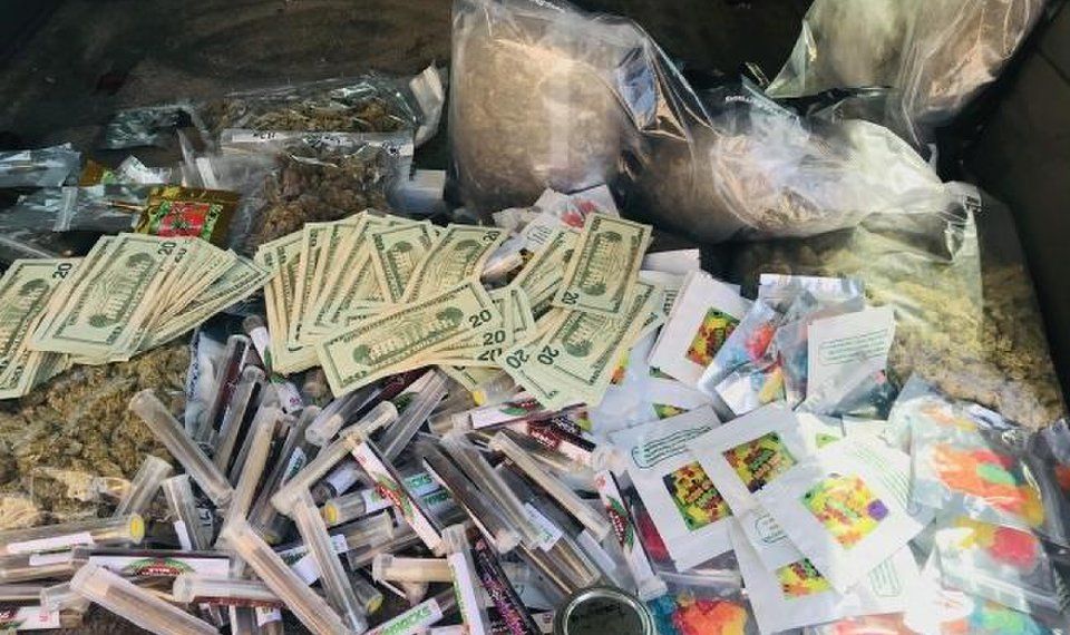 This is a defense attorney's photo of the marijuana and cash seized June 4 and returned Thursday after criminal charges were dismissed. [Photo provided]
