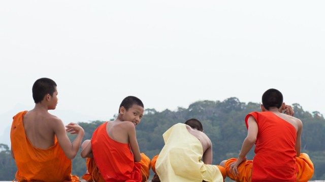 men sitting down from behind in thailand