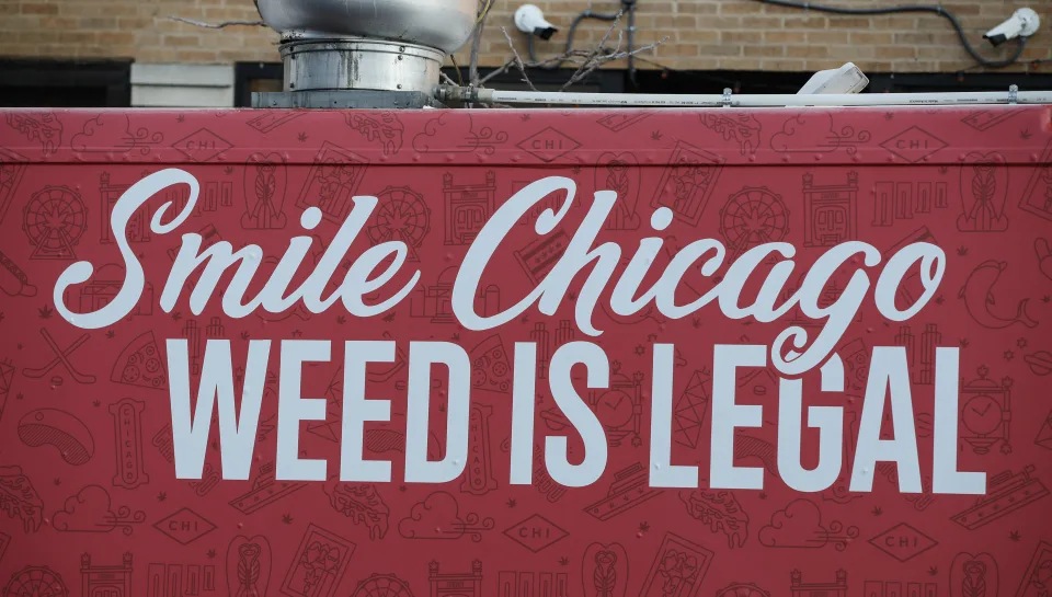 A food truck sits outside the Sunnyside Cannabis Dispensary as customers wait in line to buy marijuana, on January 1, 2020 in Chicago, Illinois. - On the first day of 2020, recreational marijuana  became legal in Illinois, which joins 10 other US states with legal use of recreational marijuana. (Photo by KAMIL KRZACZYNSKI / AFP) (Photo by KAMIL KRZACZYNSKI/AFP via Getty Images)