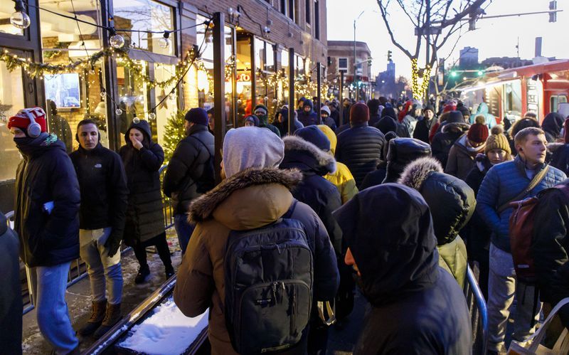 Customers line up outside before dawn on the first day of Illinois recreational marijuana sales, Jan. 1, 2020 at Sunnyside Lakeview.