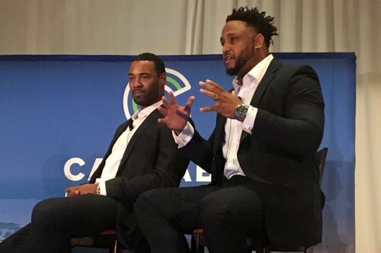 Former Detroit Lions' football players Calvin Johnson and Robert Sims talking to a crowd at the Cannabis Capital Conference in Toronto. The two gridiron stars are planning on opening medical marijuana grow operations, processing facilities and dispensaries. The conference was sponsored by Benzinga, a Detroit-based financial news company.