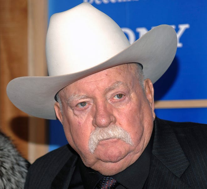 In this Monday, Dec. 14, 2009 file photo, Actor Wilford Brimley attends the premiere of 'Did You Hear About The Morgans' at the Ziegfeld Theater in New York City.  Brimley, who worked his way up from stunt performer to star of film such as Cocoon and The Natural has died at the age of 85. Brimley’s manager Lynda Bensky said the actor died Saturday morning, Aug. 1, 2020 in a Utah hospital.