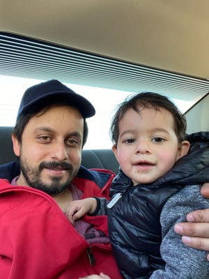 Tasbir Singh, 32, of Windsor, Ontario, poses in this February 2021 photo with his son.