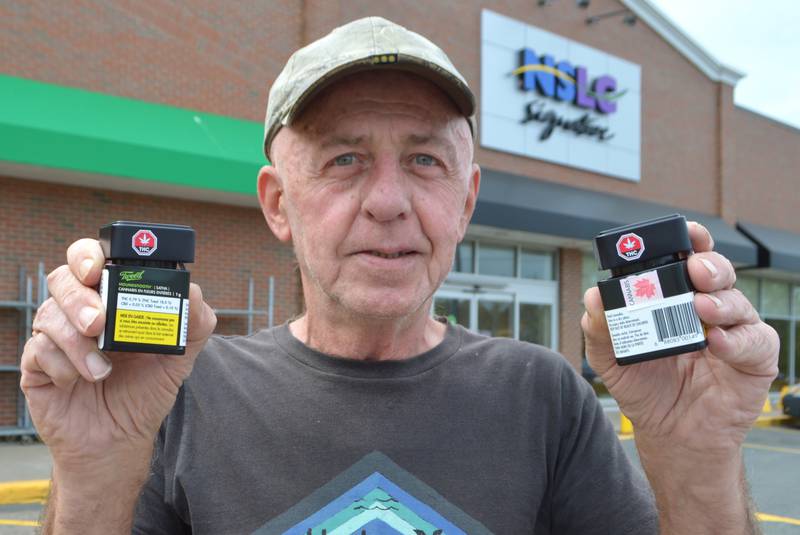 George Poulain, 67, of Point Edward, holds two containers of cannabis products outside the Nova Scotia Liquor Corporation’s Sydney River store. Poulain said on Friday he was in the process of paying for two identical products when the employee shook the containers leading to discover one contained nuts and bolts and not marijuana. Poulain said the container in question still had the government seal so whatever happened to the product had to have happened at the plant, Canopy Growth Corporation of Smith Falls, Ont.