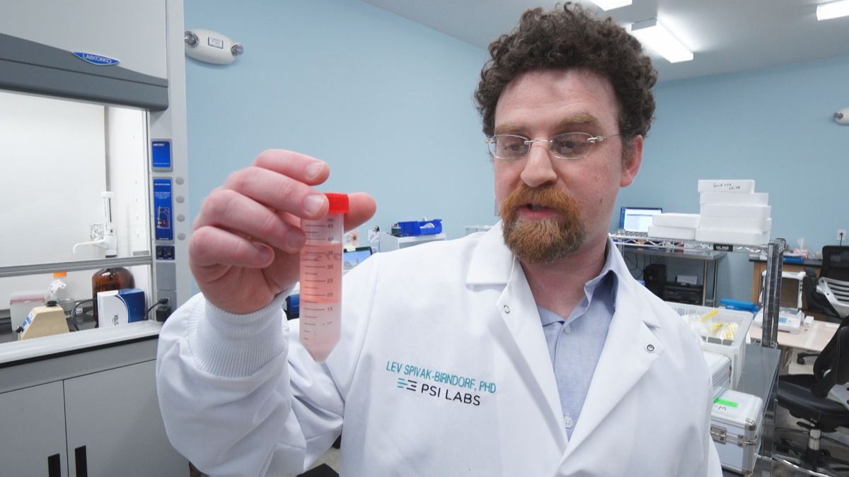 Lab Director Lev Spivek-Birndorf explains the liquid on the top holds the CBD, and the liquid on the bottom has the inactive ingredients. (WTHR)